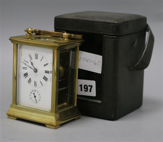 An early 20th century cased brass carriage timepiece, with alarm height 12cm